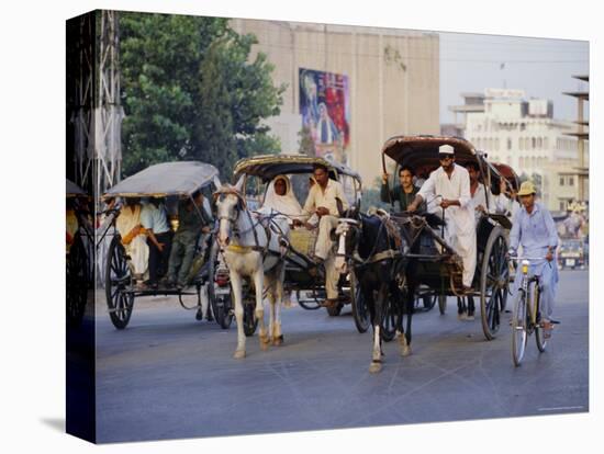 Street Scene with Horse Drawn Carriages, Rawalpindi, Punjab, Pakistan-David Poole-Premier Image Canvas
