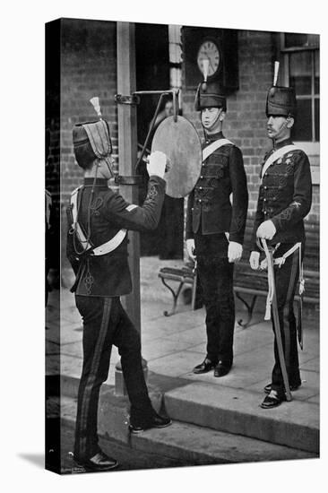 Striking the Gong at the Main Gate of the Aldershot Cavalry Barracks, Hampshire, 1896-Gregory & Co-Premier Image Canvas