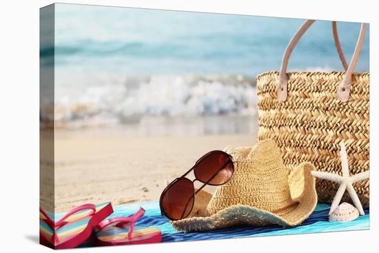 Summer Beach Bag with Straw Hat,Towel,Sunglasses and Flip Flops on Sandy Beach-Sofiaworld-Premier Image Canvas