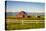 Summer Evening with a Red Barn and Silos in Rural Montana with Rocky Mountains in the Background.-Nick Fox-Premier Image Canvas