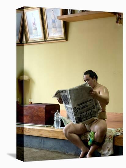 Sumo Wrestler Reading Newspaper, Tokyo City, Honshu Island, Japan-Christian Kober-Premier Image Canvas