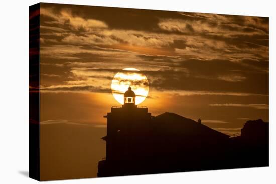 Sun aligned with the silhouette of the lighthouse of Luarca, Asturias, Spain, Europe-Francesco Fanti-Premier Image Canvas