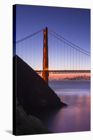 Sunrise Of A Single Bridge Of The Golden Gate Bridge, With The San Francisco Skyline And Bay Bridge-Joe Azure-Stretched Canvas