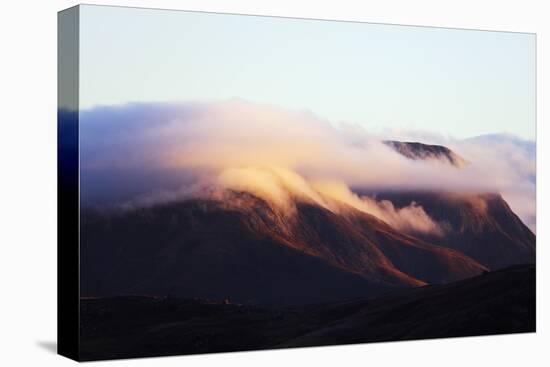 Sunrise on a cloud topped mountain, Andringitra National Park, Ambalavao, central area, Madagascar,-Christian Kober-Premier Image Canvas