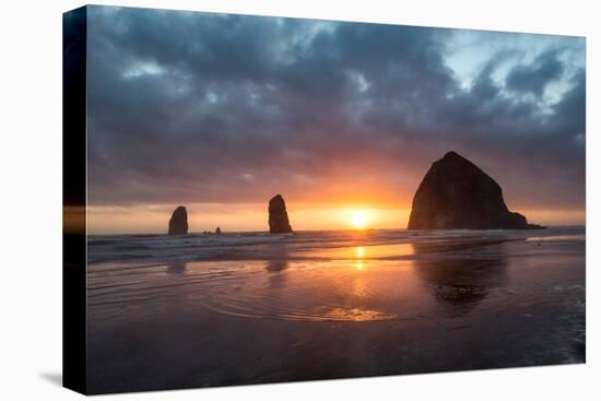 Sunset behind Haystack Rock at Cannon Beach on the Pacific Northwest coast, Oregon, United States o-Martin Child-Premier Image Canvas