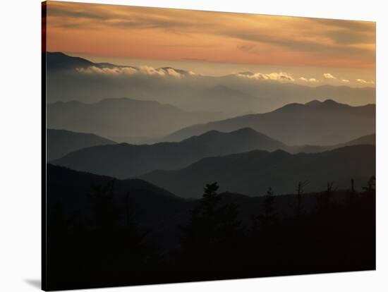 Sunset Casts a Colorful Glow over Mountaintops Shrouded in Fog-James P^ Blair-Stretched Canvas