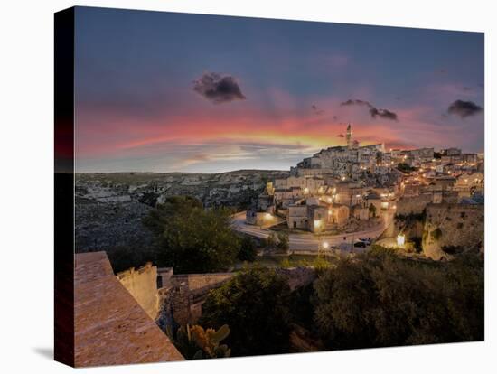 Sunset on the ancient town and historical center called Sassi, perched on rocks on top of hill, Mat-Roberto Moiola-Premier Image Canvas