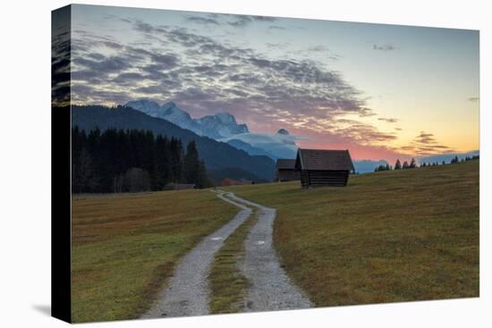 Sunset on wooden huts and meadows with the Alps in background, Geroldsee, Krun, Garmisch Partenkirc-Roberto Moiola-Premier Image Canvas