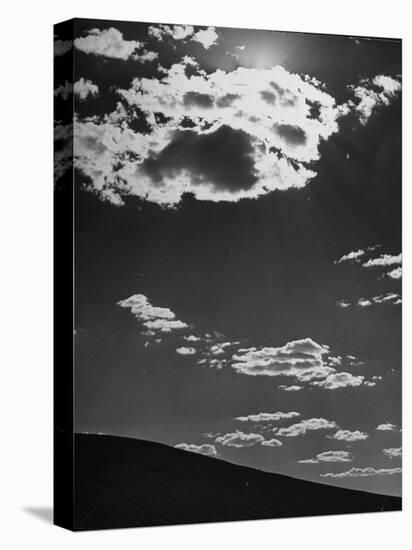 Sunshine Filled Clouds Against Dark Sky, Above Dark Dune in Middle of Kalahan Desert, Bechuanaland-Nat Farbman-Premier Image Canvas