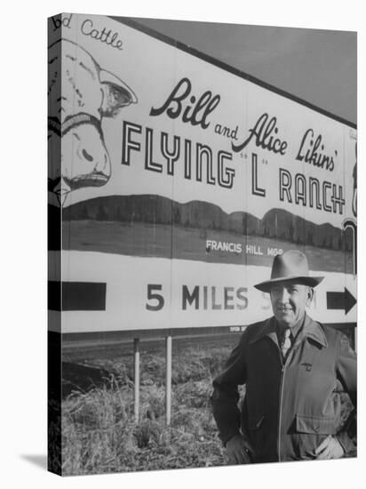 Super Rich Texas Millionaires William Likins Standing in Front of Sign at Main Entrance to Ranch-Michael Rougier-Premier Image Canvas