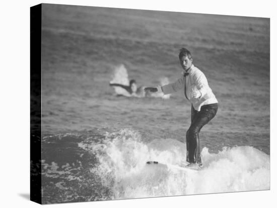 Surfer Riding a Wave While Wearing a Tuxedo-Allan Grant-Premier Image Canvas
