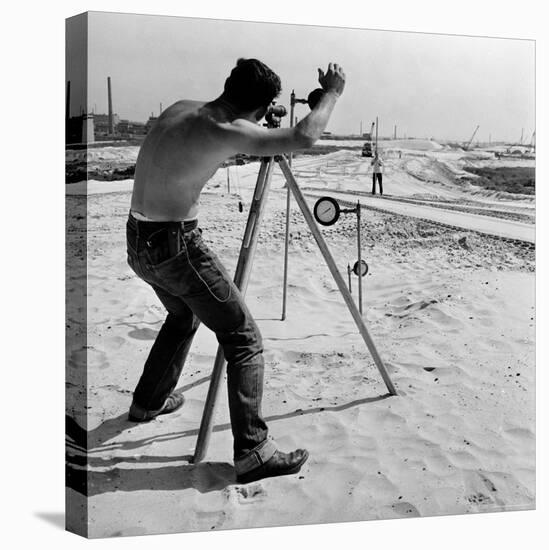 Surveyor Taking Measurements During Construction of the New Jersey Turnpike-Bernard Hoffman-Premier Image Canvas