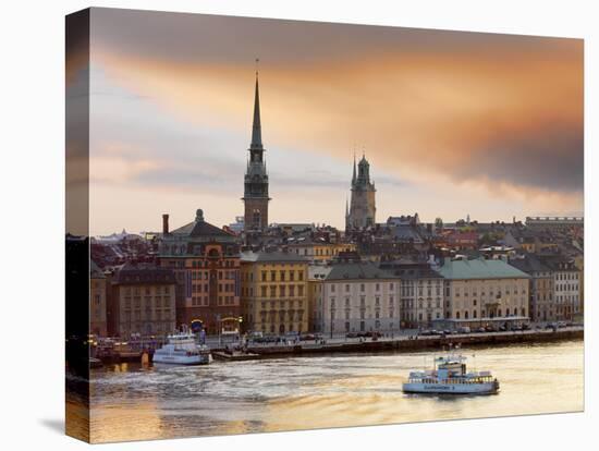 Sweden, Stockholm, Riddarfjarden, Gamla Stan, Passenger Ferries in Bay at Dusk-Shaun Egan-Premier Image Canvas