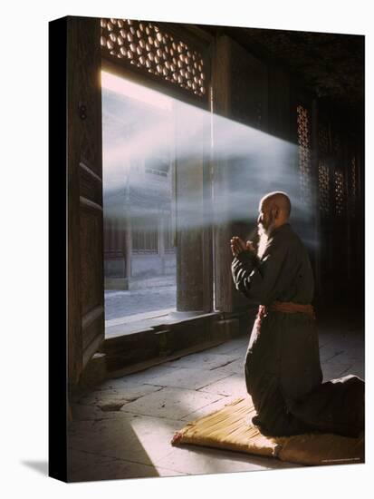 Taoist Monk in Prayer at Temple in Beijing-Dmitri Kessel-Premier Image Canvas