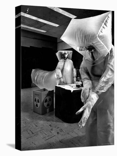 Technicians in Plastic Protective Suits and Face Masks Repair Pressure Valve at Atomic Energy Plant-Nat Farbman-Premier Image Canvas