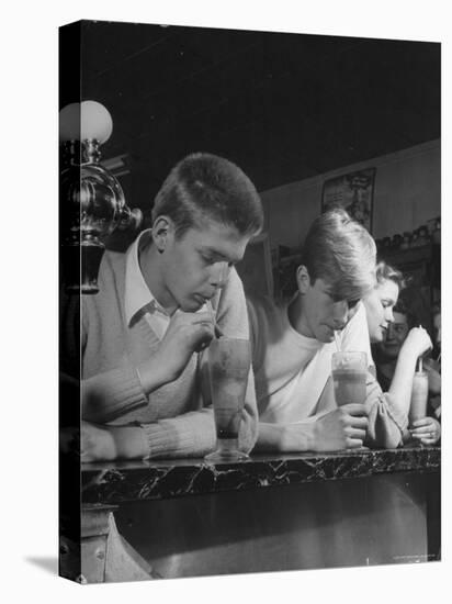 Teen Age Boys and Girls Drinking Milkshakes in Drug Store-Nina Leen-Premier Image Canvas