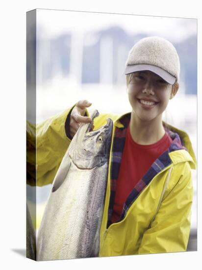 Teen Girl Holding a Fish-null-Premier Image Canvas