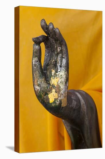 Thailand. Buddha Statue hand with gold leaf tokens.-Brenda Tharp-Premier Image Canvas