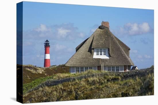 Thatched Roof House in the 'Kersig-Siedlung' of Hšrnum in Front of the Lighthouse-Uwe Steffens-Premier Image Canvas