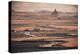 The badlands of Bardenas Reales at sunrise with a winding road leading towards the Castildetierra-Francesco Fanti-Premier Image Canvas