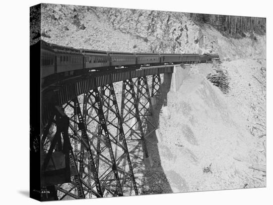 The Chicago, Milwaukee & Puget Sound Railway Columbian Crossing a Bridge, Circa 1913-Asahel Curtis-Premier Image Canvas