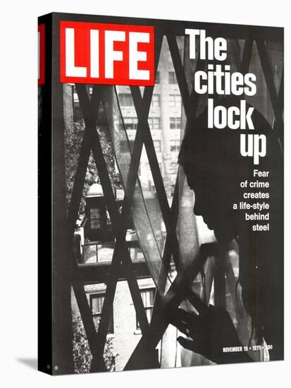 The Cities Lock Up, Woman at Gated Window, November 19, 1971-John Loengard-Premier Image Canvas