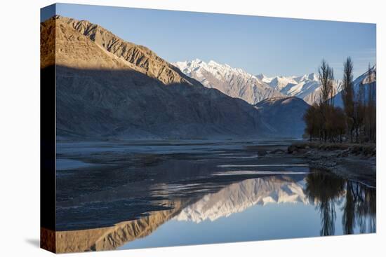 The crystal clear Shyok River creates a mirror image in the Khapalu valley near Skardu, Pakistan-Alex Treadway-Premier Image Canvas