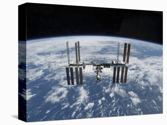 The International Space Station in Orbit Above the Earth-null-Premier Image Canvas