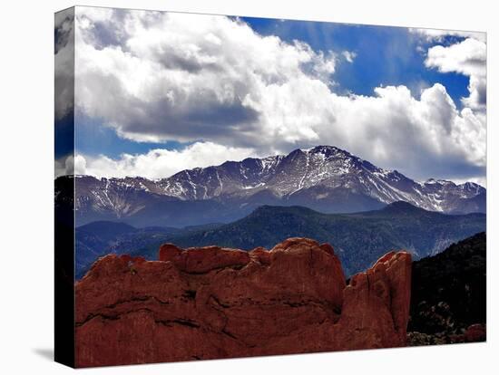 The Sun Breaks Through the Clouds to Highlight the Summit of Pikes Peak-null-Premier Image Canvas