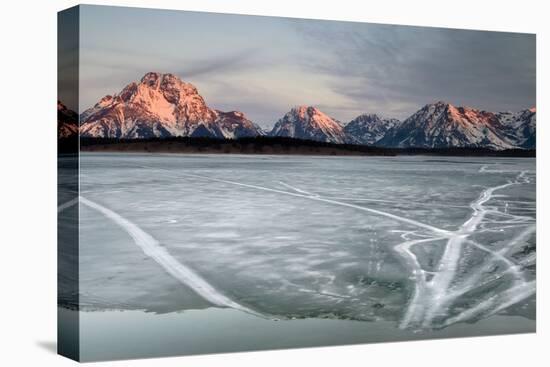 The Sunrises Over The Tetons And An Ice Covered Jackson Lake In Grand Teton National Park, Wyoming-Jay Goodrich-Premier Image Canvas