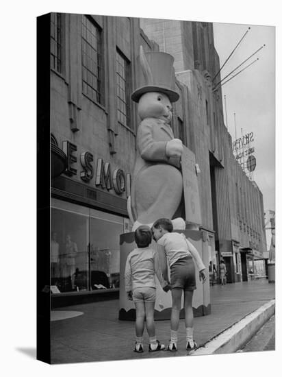 The Toll Brothers Admiring 6 Ft. Easter Bunny-Bob Landry-Premier Image Canvas