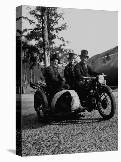Three Chimney Sweeps Riding a Motorcycle-Dmitri Kessel-Premier Image Canvas