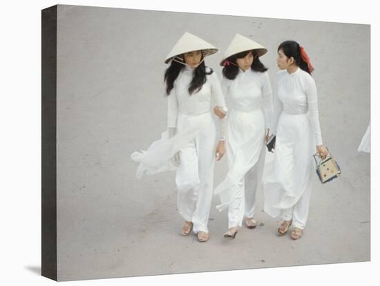 Three Vietnamese Young Women in White Fashion Walking Down the Street-Co Rentmeester-Premier Image Canvas