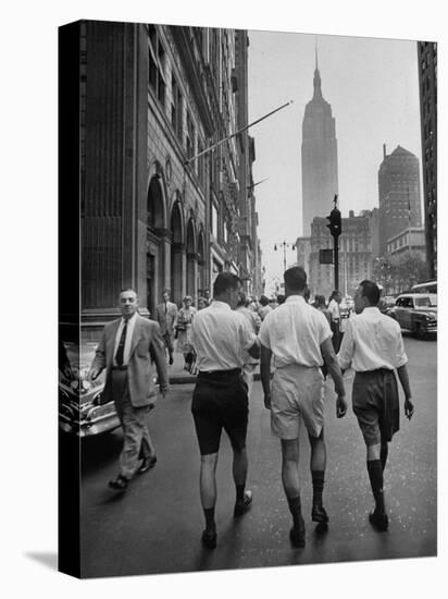 Three Young Businessmen Wearing Bermuda Shorts as They Walk Along Fifth Ave. During Lunchtime-Lisa Larsen-Premier Image Canvas