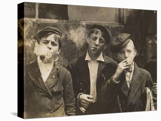 Three Young Newsboys Smoking, Saint Louis, Missouri, USA, circa 1910-Lewis Wickes Hine-Premier Image Canvas