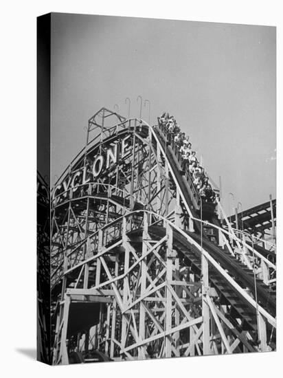 Thrill Seekers at the Top of the Cyclone Roller Coaster at Coney Island Amusement Park-Marie Hansen-Premier Image Canvas