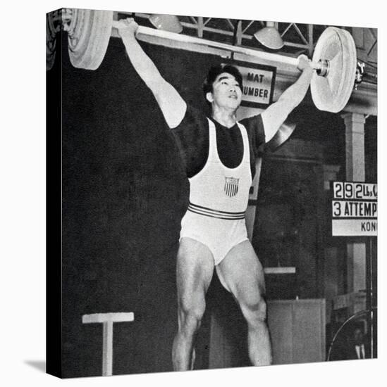 Tommy Kono Winning the Gold Medal for Men's Weightlifting at the 1956 Melbourne Olympics-null-Premier Image Canvas