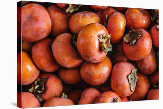 Top View Close Up Of Freshly Picked Persimmons In Sonoma County-Ron Koeberer-Stretched Canvas