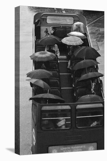 Tourists under Umbrellas on Open Top Bus, 1976-Kent Gavin-Premier Image Canvas