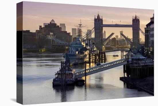 Tower Bridge raising deck with HMS Belfast on the River Thames, London, England, United Kingdom, Eu-Charles Bowman-Premier Image Canvas