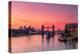 Tower Bridge, River Thames and HMS Belfast at sunrise with pink sky, and Canary Wharf-Ed Hasler-Premier Image Canvas