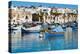 Traditional brightly painted fishing boats in the harbour at Marsaxlokk, Malta, Mediterranean, Euro-Martin Child-Premier Image Canvas