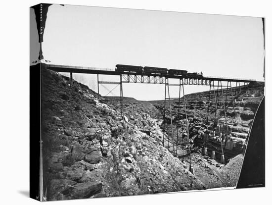 Train Traveling over Santa Fe Railroad Bridge, Which is Built over Canyon Diablo-null-Premier Image Canvas