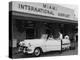 Travelers in a Chevy Bel Air Convertible at the Miami International Airport, 1954 August 22-null-Premier Image Canvas