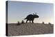 Triceratops Walking across a Barren Landscape-null-Stretched Canvas