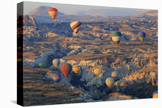 Turkey, Anatolia, Cappadocia, Goreme. Hot air balloons above Red Valley.-Emily Wilson-Premier Image Canvas