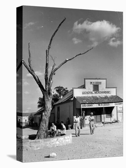 Two Boys Playing Nr. a Dead Tree as Judge Roy Langrty and a Man Walk Past a General Store-Alfred Eisenstaedt-Premier Image Canvas