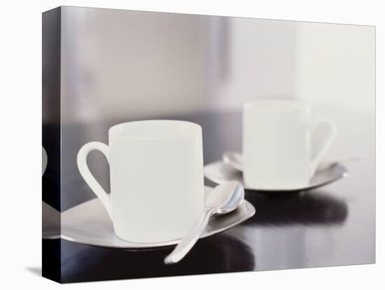 Two coffee cups on a table-null-Premier Image Canvas