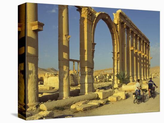 Two Cyclists Pass the Great Colonnade (Cardo), Palmyra, Unesco World Heritage Site, Syria-Eitan Simanor-Premier Image Canvas