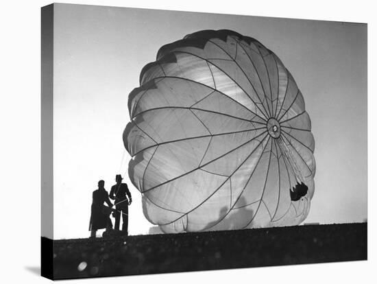 Two Irving Air Chute Co. Employees Struggling to Pull Down One of their Parachutes after Test Jump-Margaret Bourke-White-Premier Image Canvas